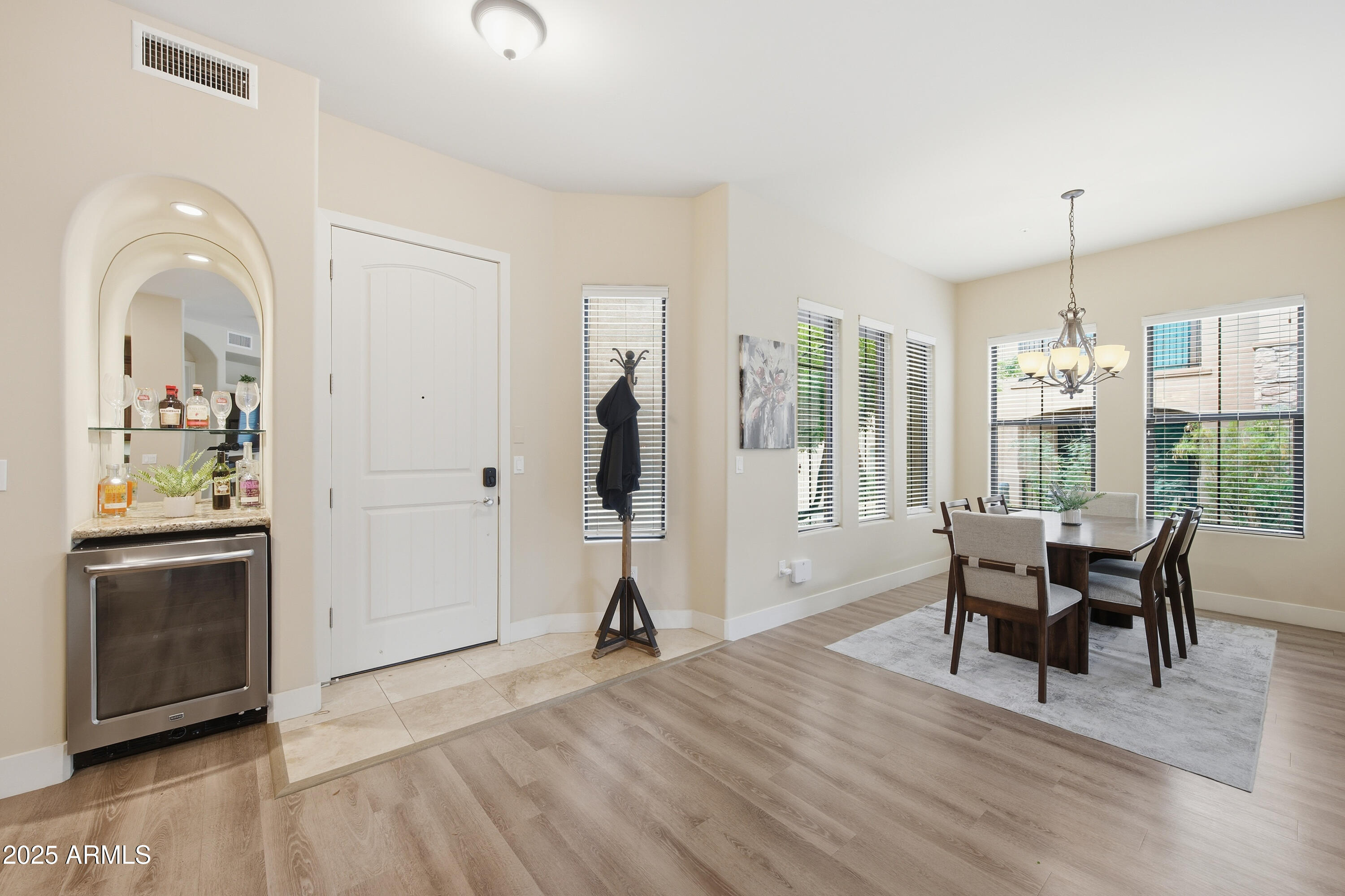 15550 South 5th Avenue, Unit 159 Phoenix, AZ 85045 - Photo 8 of 44 a view of a livingroom with furniture window and wooden floor