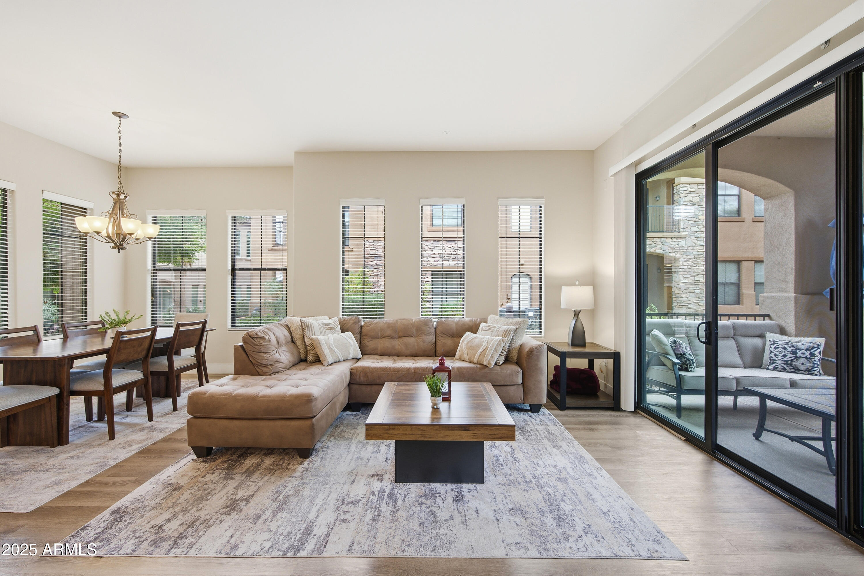 15550 South 5th Avenue, Unit 159 Phoenix, AZ 85045 - Photo 9 of 44 a living room with furniture and large windows
