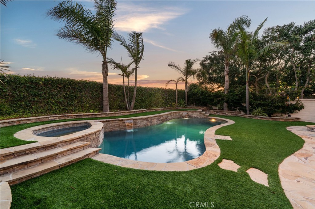 6572 Beachview Drive Huntington Beach, CA 92648 - Photo 14 of 17 a view of a swimming pool with a yard