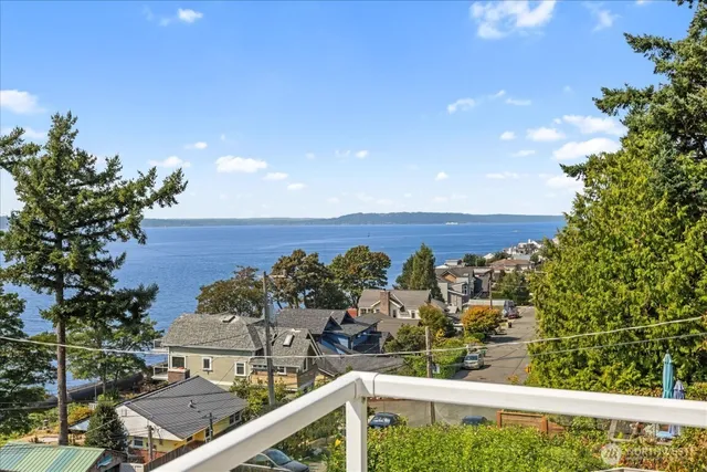 a view of a balcony with an outdoor seating
