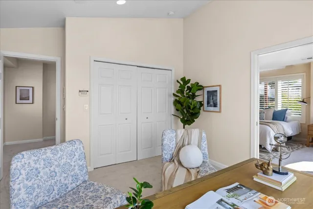 a living room with furniture and a potted plant