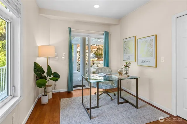 a view of a livingroom with table and a potted plant