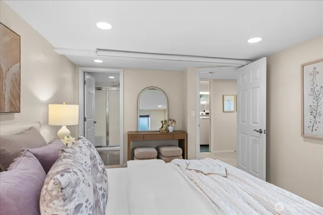 a bedroom with a bed and a lamp