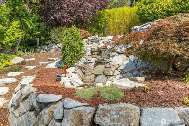 a view of a backyard of the house
