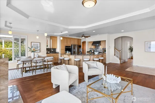a living room with lots of furniture and kitchen view