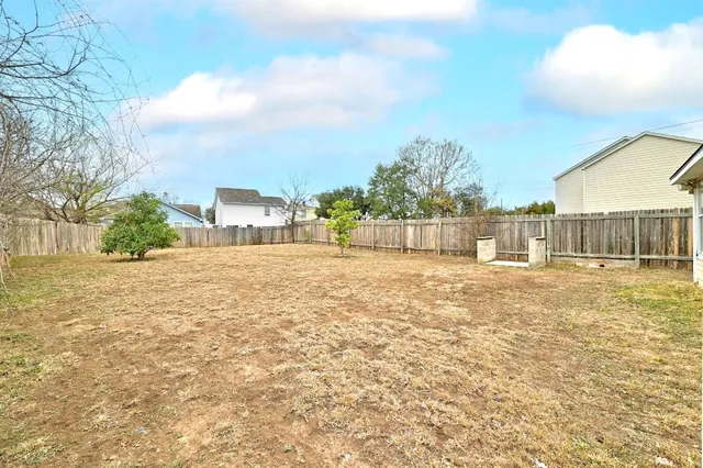 a view of a room with a large window