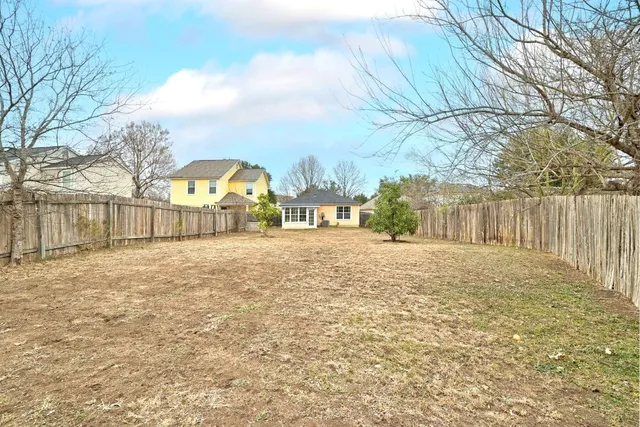 a swimming pool with outdoor seating and deck