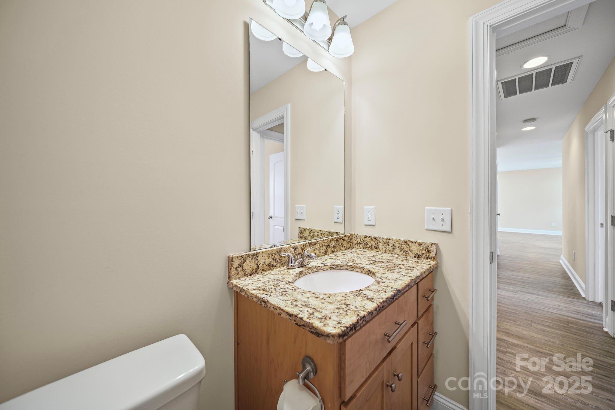 157 Crescent Street Kannapolis, NC 28081 - Photo 26 of 36 a bathroom with a sink a toilet and a mirror