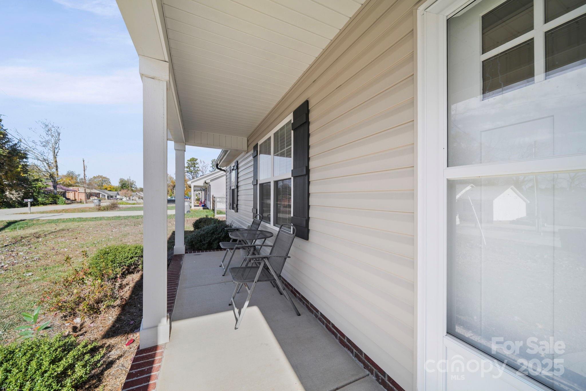 157 Crescent Street Kannapolis, NC 28081 - Photo 5 of 36 a balcony with furniture and a potted plant