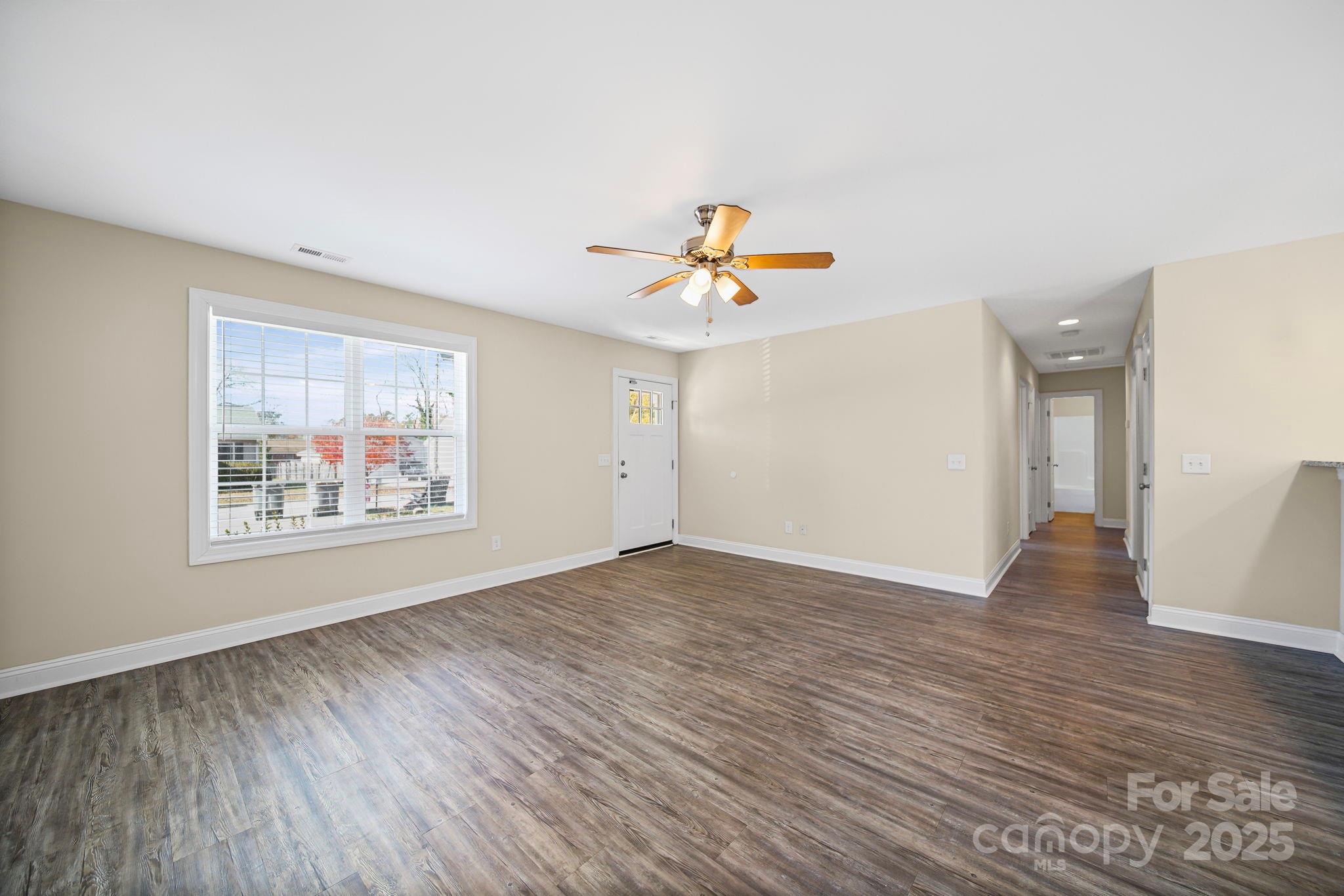 157 Crescent Street Kannapolis, NC 28081 - Photo 9 of 36 wooden floor in an empty room with a window