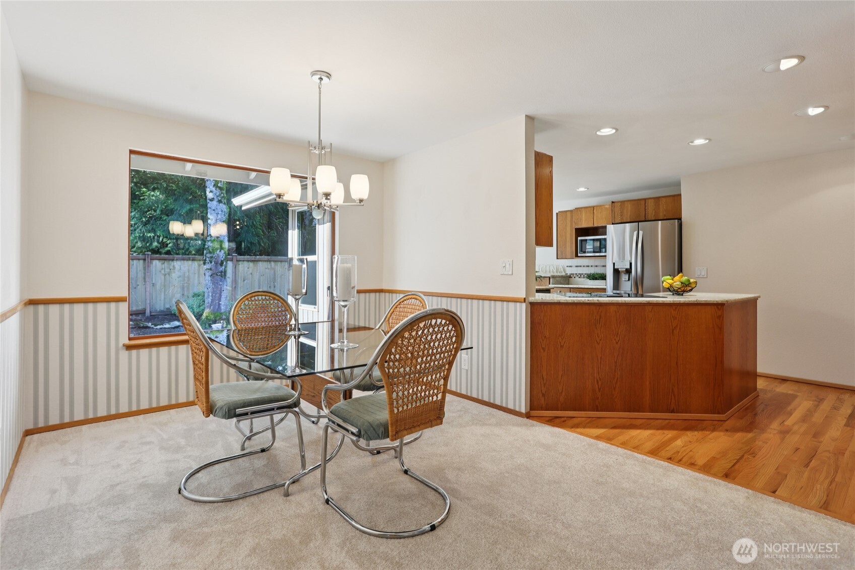 16535 147th Avenue Southeast Renton, WA 98058 - Photo 12 of 37 a work room with furniture and wooden floor