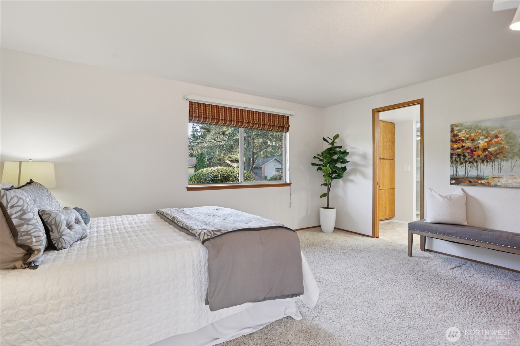 16535 147th Avenue Southeast Renton, WA 98058 - Photo 19 of 37 a bedroom with a large bed and a couch