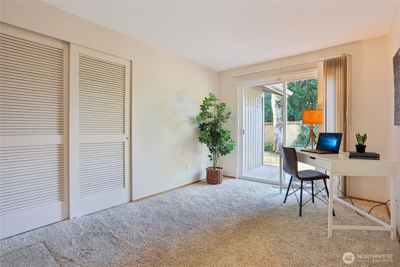 16535 147th Avenue Southeast Renton, WA 98058 - Photo 26 of 37 a living room with furniture and a window