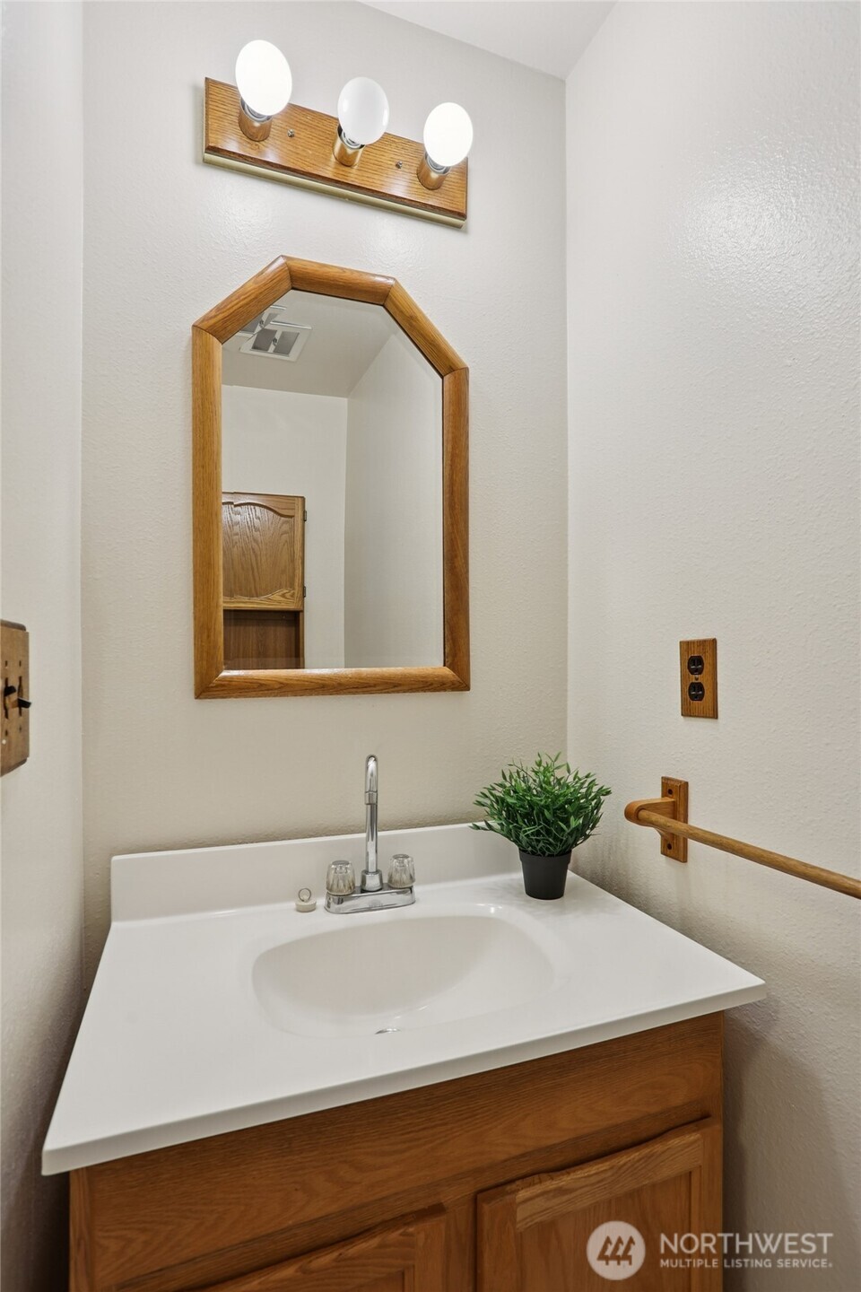 16535 147th Avenue Southeast Renton, WA 98058 - Photo 27 of 37 a bathroom with a sink vanity and mirror