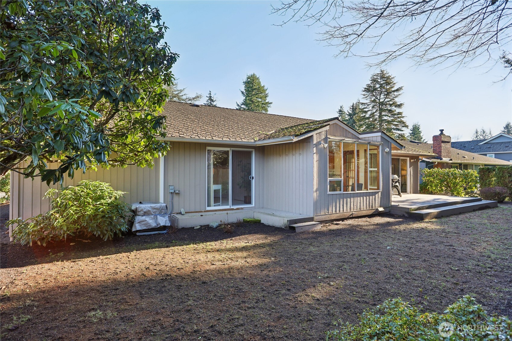 16535 147th Avenue Southeast Renton, WA 98058 - Photo 32 of 37 a view of a house with a yard and potted plants