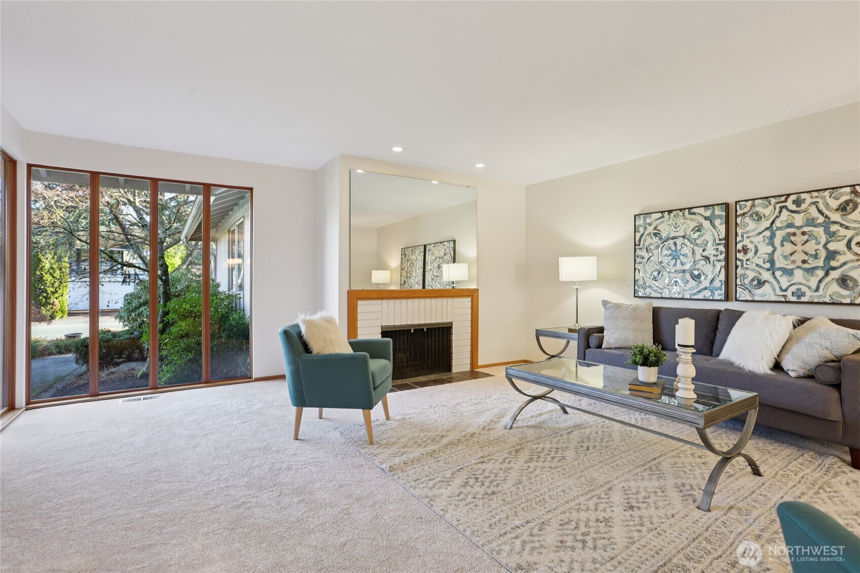 16535 147th Avenue Southeast Renton, WA 98058 - Photo 5 of 37 a living room with furniture and a fireplace