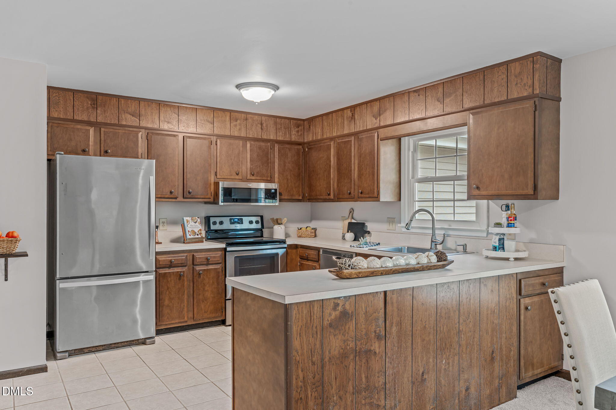 3304 Wade Avenue Raleigh, NC 27607 - Photo 12 of 38 a kitchen with stainless steel appliances granite countertop a refrigerator stove a sink and dishwasher