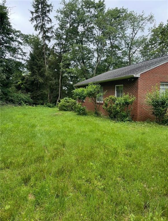 368 Turkeyfoot Road Venetia, PA 15367 - Photo 23 of 28 a view of a backyard with plants and large trees