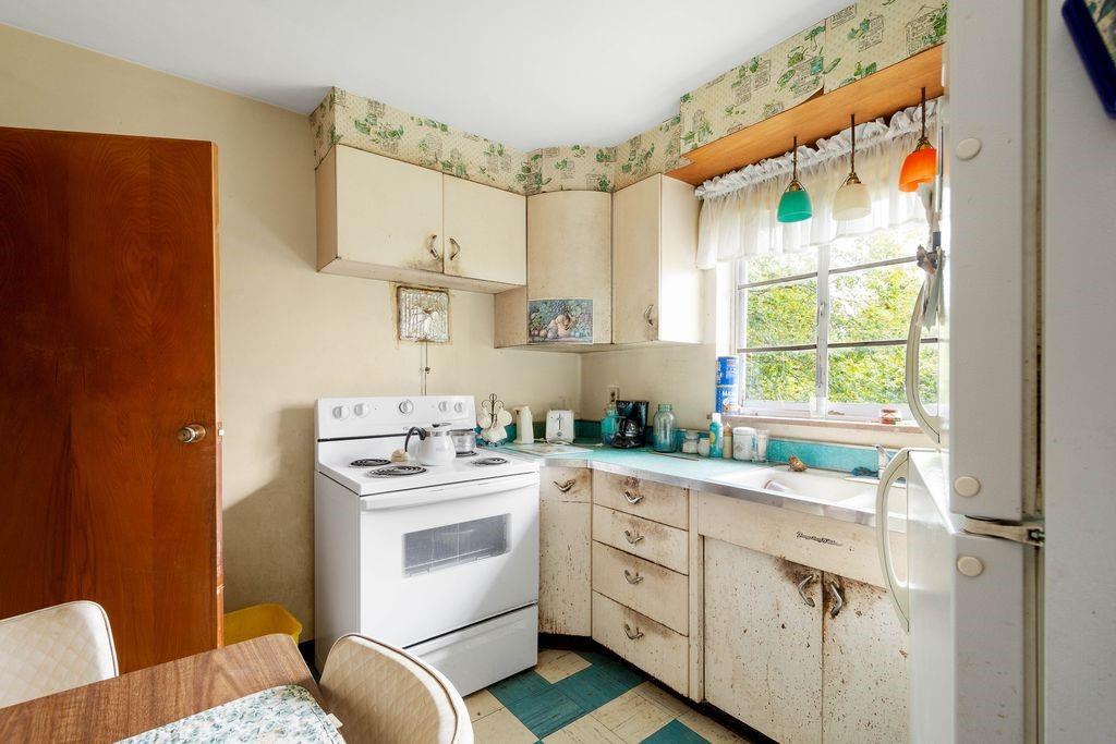 368 Turkeyfoot Road Venetia, PA 15367 - Photo 7 of 28 a kitchen with white cabinets and white appliances