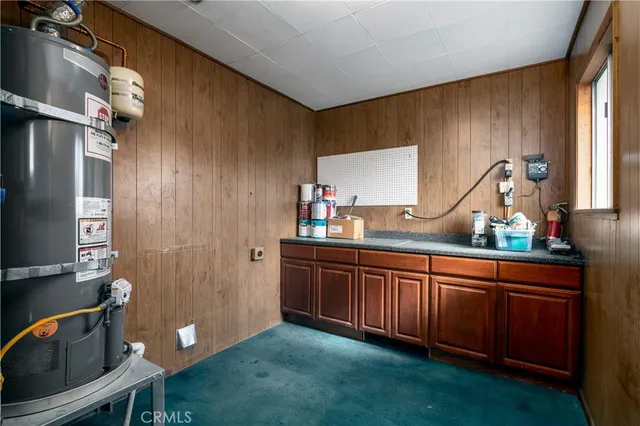 an aerial view of a houses with a lake