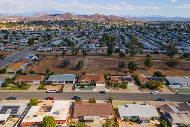 an aerial view of residential house and sandy dunes
