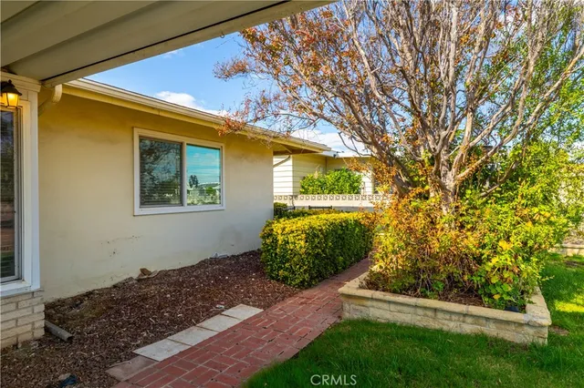 a view of a street with a building and a big yard