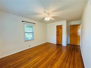 1015 West Sycamore Street Sherman, TX 75092 - Photo 30 of 35 wooden floor in an empty room with a window