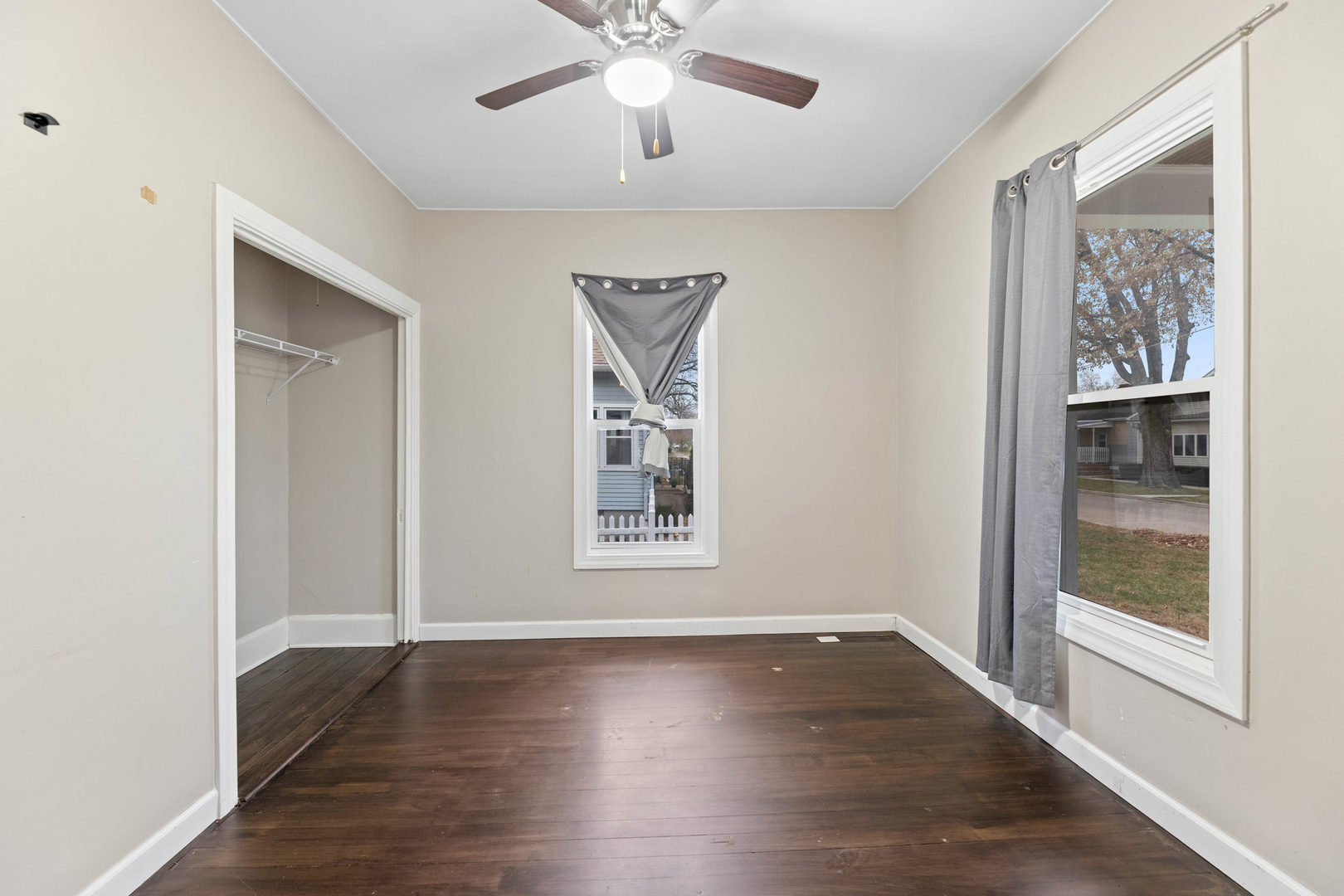 809 Poplar Street Ottawa, IL 61350 - Photo 11 of 22 a view of an empty room with wooden floor and a window