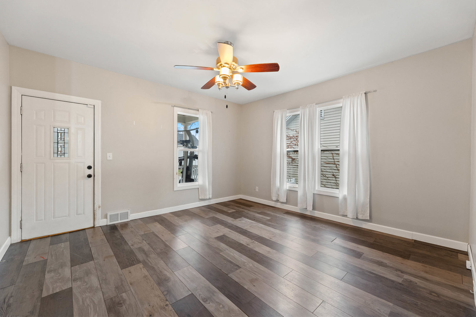 809 Poplar Street Ottawa, IL 61350 - Photo 2 of 22 wooden floor in an empty room with a window
