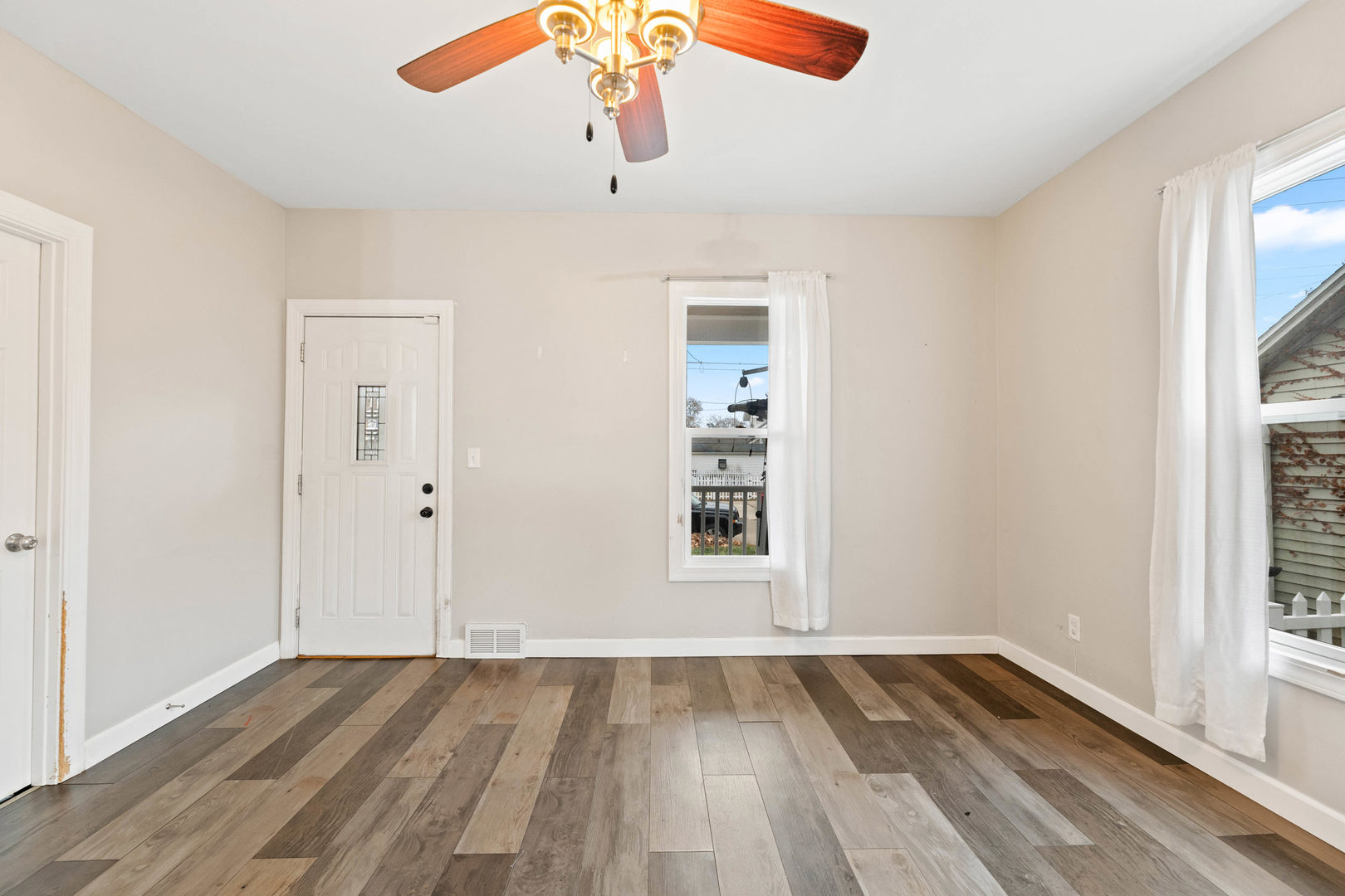 809 Poplar Street Ottawa, IL 61350 - Photo 3 of 22 wooden floor in an empty room with a window