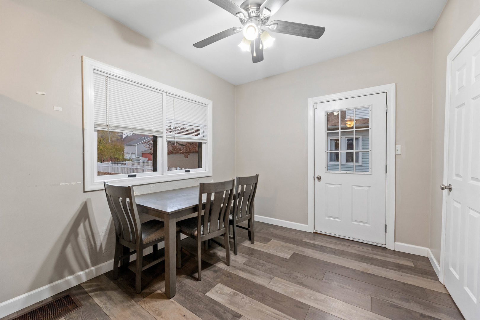 809 Poplar Street Ottawa, IL 61350 - Photo 6 of 22 a dining room with wooden floor and chandelier