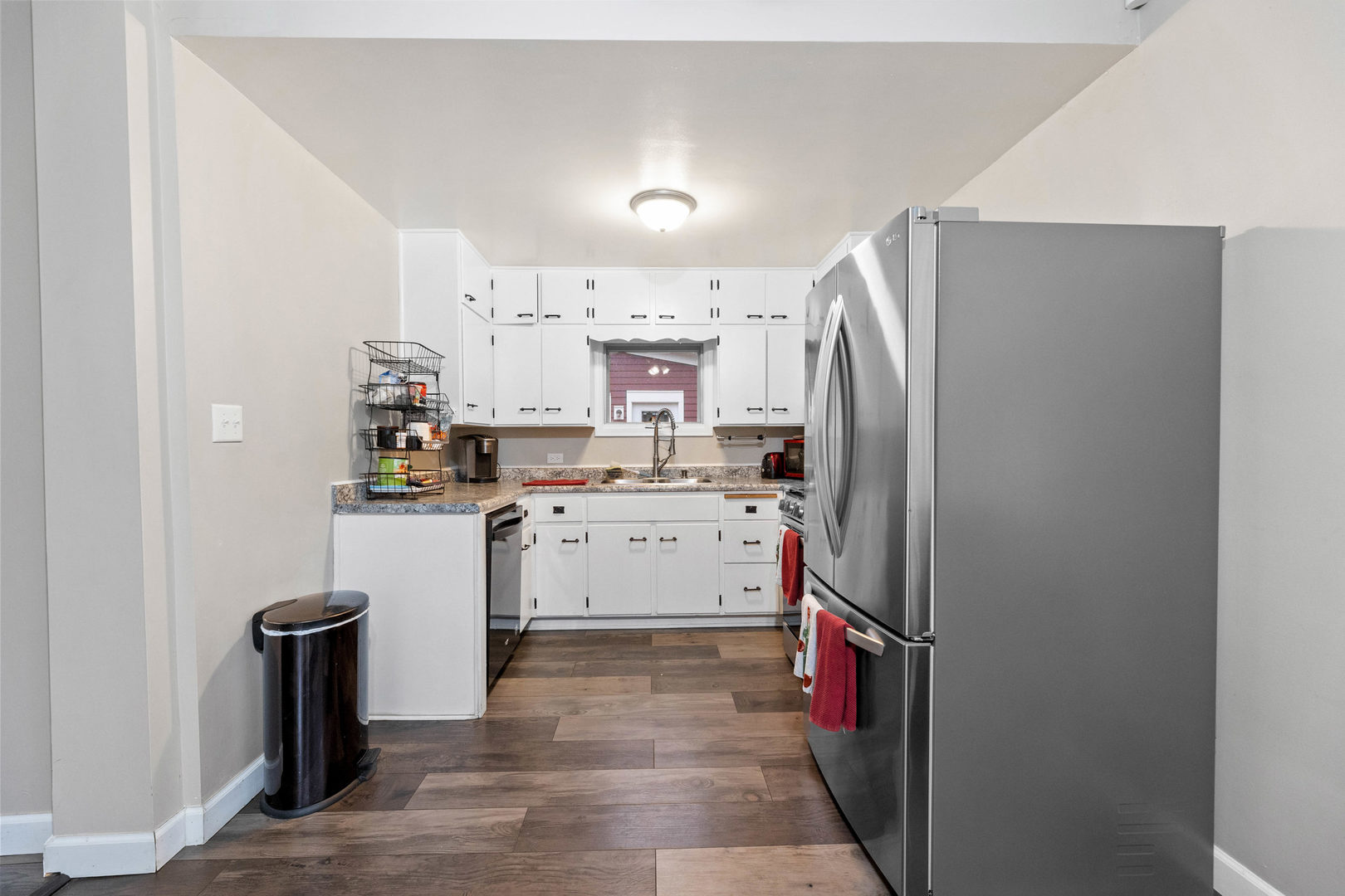 809 Poplar Street Ottawa, IL 61350 - Photo 7 of 22 a kitchen with refrigerator cabinets and a sink