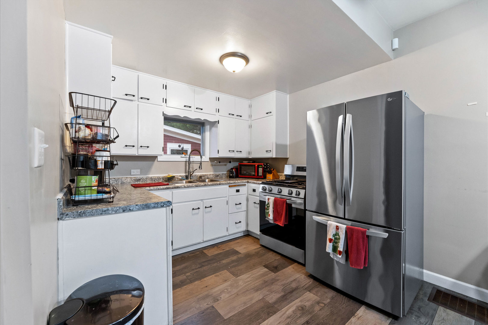 809 Poplar Street Ottawa, IL 61350 - Photo 8 of 22 a kitchen with stainless steel appliances granite countertop a refrigerator sink and stove