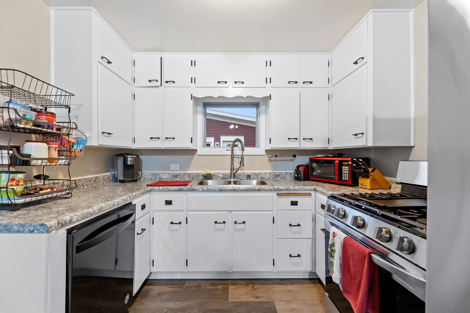 809 Poplar Street Ottawa, IL 61350 - Photo 9 of 22 a kitchen with stainless steel appliances a stove a sink and cabinets