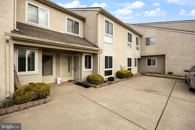 a front view of a house with backyard