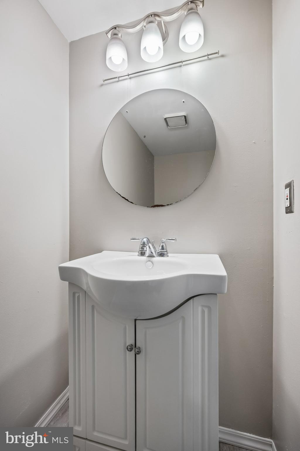 45 Sandra Road Voorhees, NJ 08043 - Photo 13 of 28 a bathroom with a sink and mirror