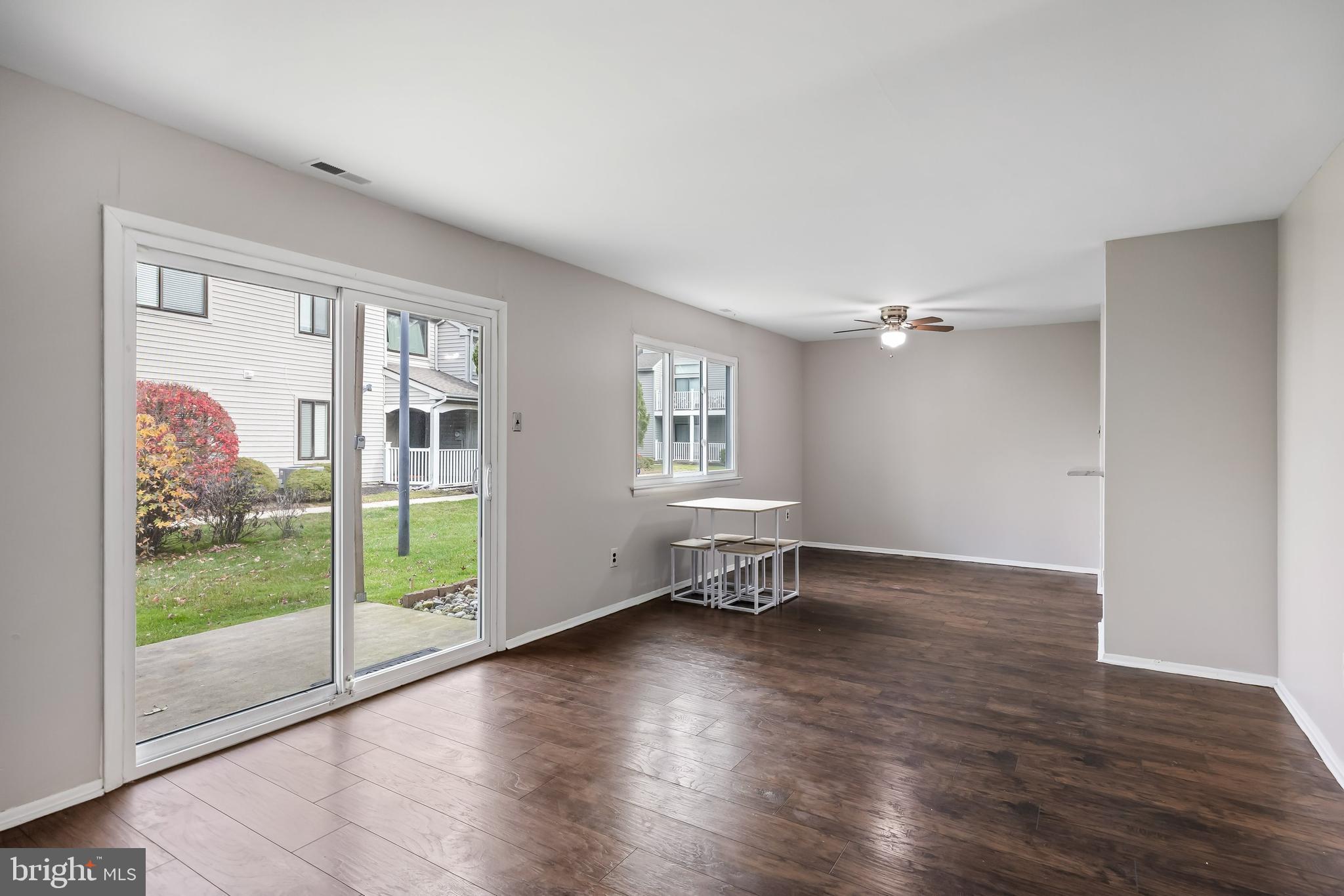 45 Sandra Road Voorhees, NJ 08043 - Photo 3 of 28 a view of an empty room with glass door and a window