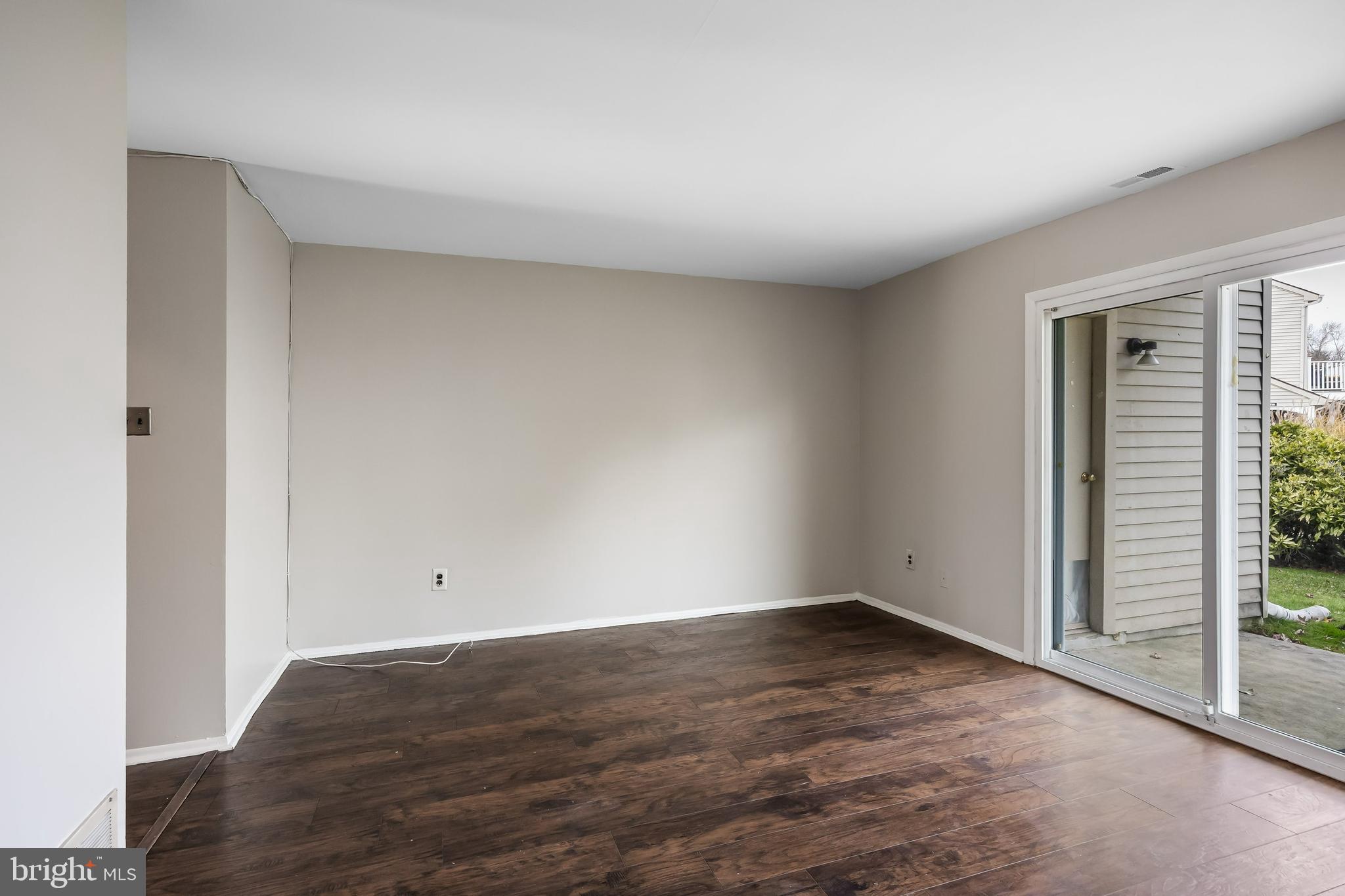 45 Sandra Road Voorhees, NJ 08043 - Photo 5 of 28 an empty room with wooden floor and windows