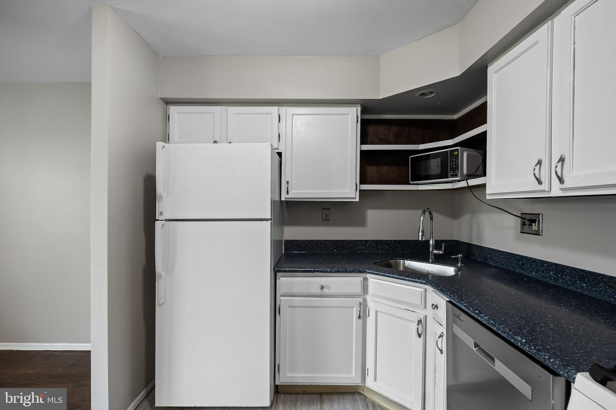45 Sandra Road Voorhees, NJ 08043 - Photo 10 of 28 a kitchen with appliances cabinets and a counter top space