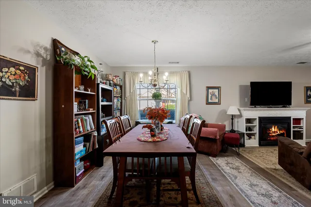 a view of a livingroom with furniture window and a fireplace