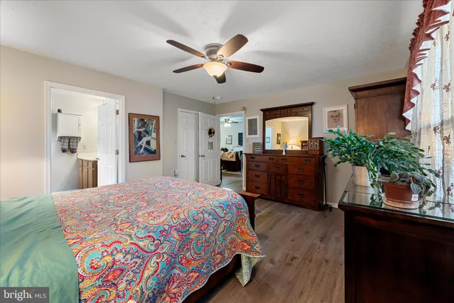 a bedroom with a bed and a dresser