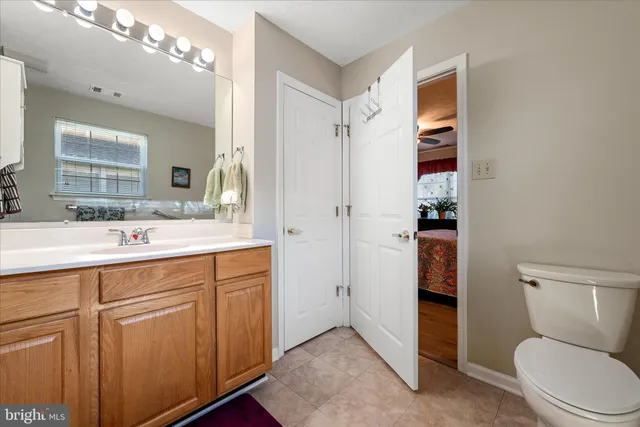 a spacious bathroom with a toilet sink and shower