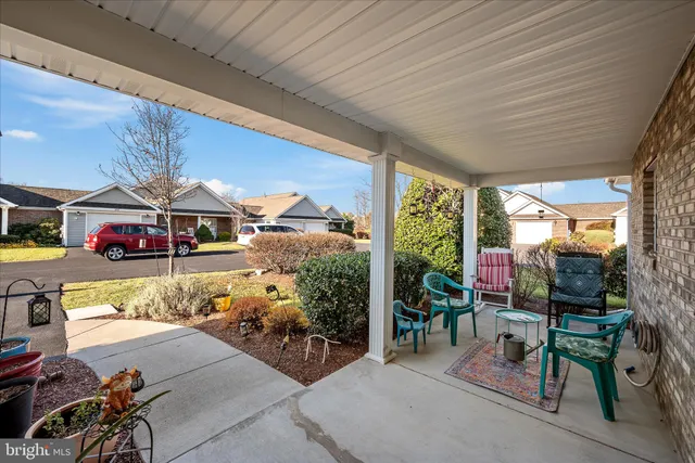 a view of a chairs and tables in patio