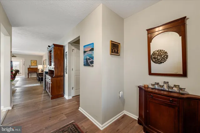 a view of a livingroom with furniture and wooden floor