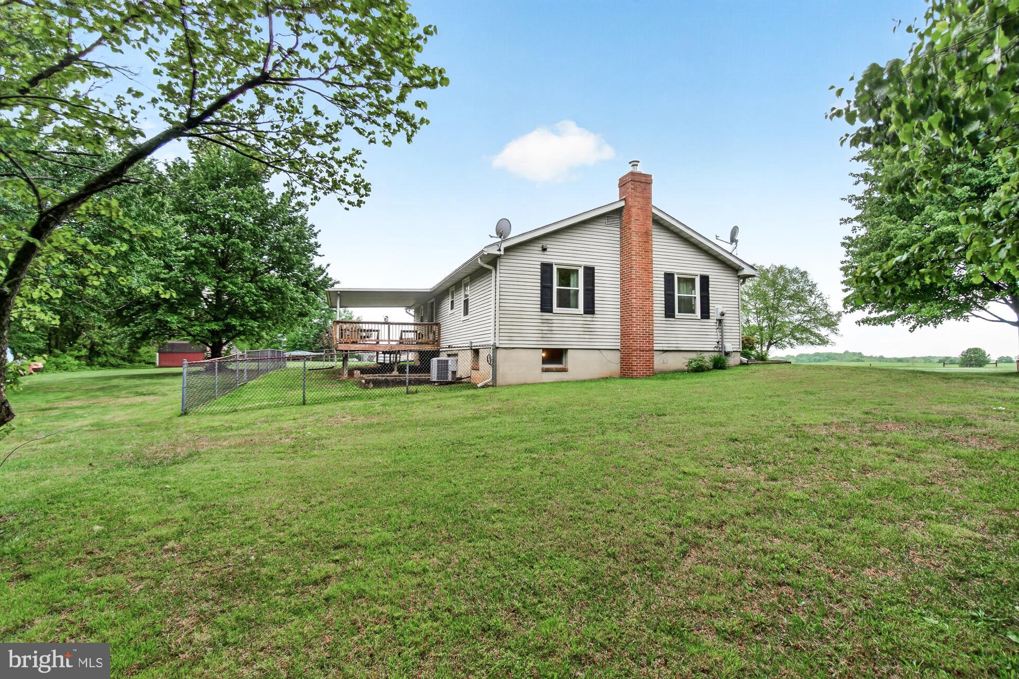5601 Woodville Road Mount Airy, MD 21771 - Photo 44 of 54 a front view of house with yard and green space