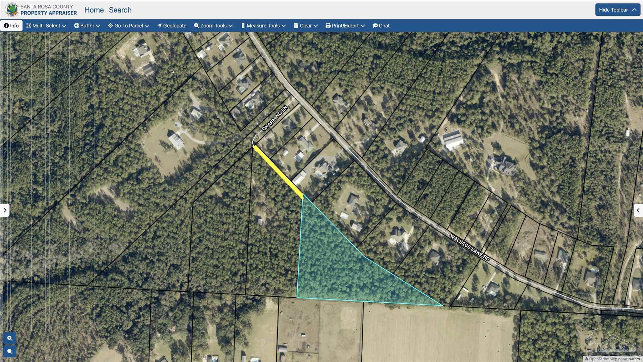 1 Wallace Lake Road Pace, FL 32571 - Photo 5 of 5 a view of a yard with a tree