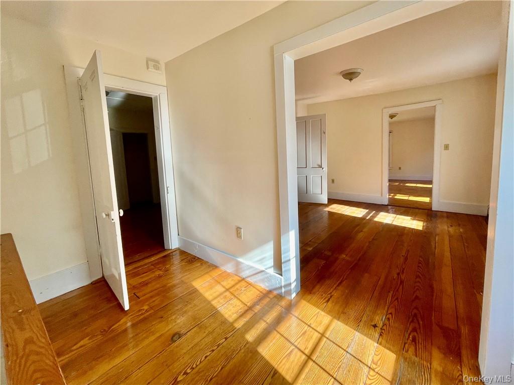 17 Ribbecke Hill Road, Unit 1 Pine Bush, NY 12566 - Photo 6 of 13 a view of an empty room with wooden floor