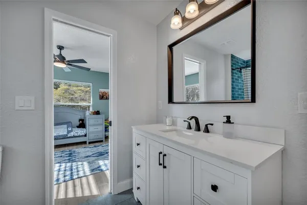 a en suite bathroom with a toilet sink and mirror