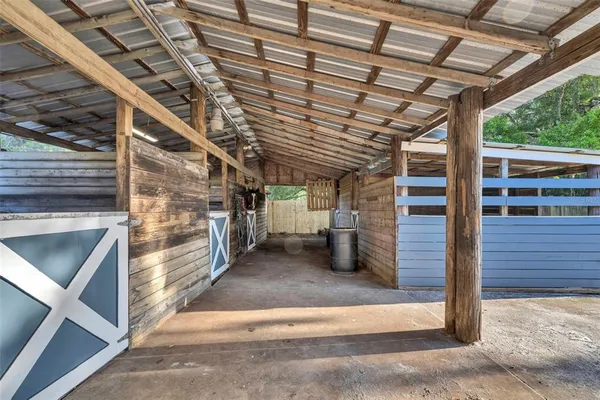 a view of a porch with wooden floor