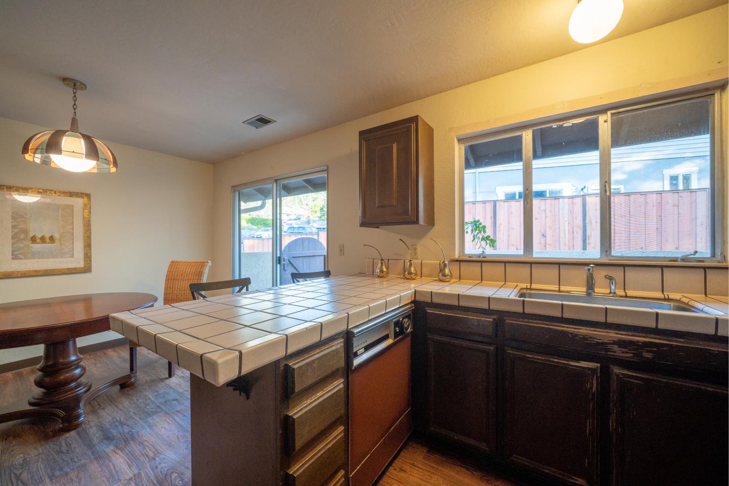 935 Park Pacifica Avenue Pacifica, CA 94044 - Photo 15 of 44 a kitchen with a sink window and cabinets